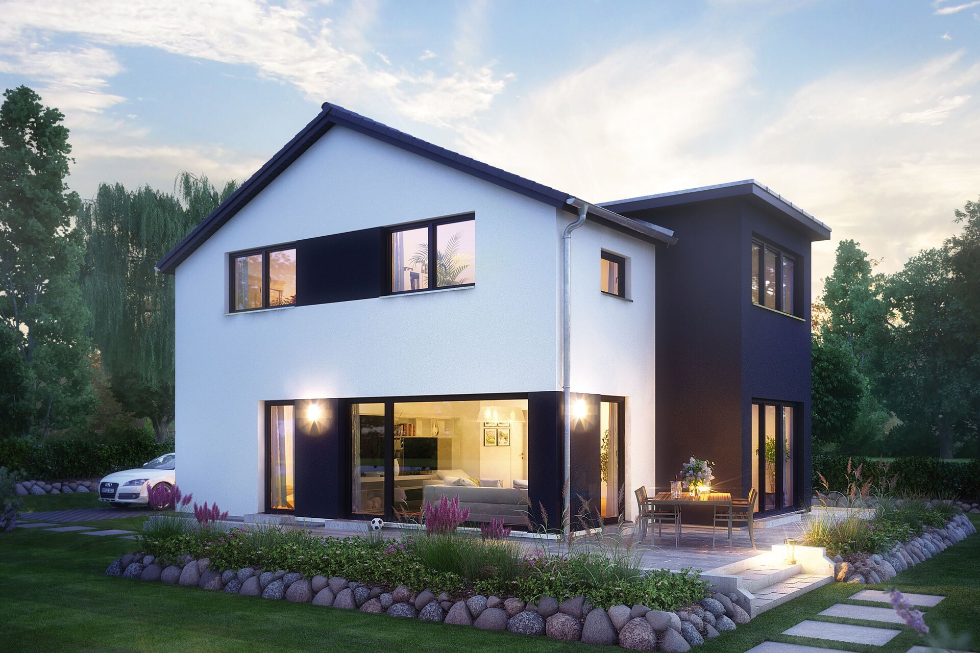 FingerHaus MEDLEY 411 – modernes zweigeschossiges Einfamilienhaus mit Satteldach, weiß-grauer Fassade und großen Fenstern in Abendstimmung. Die Innenbeleuchtung leuchtet durch die Glasflächen, im Garten befinden sich Rasen, Steinweg und Blumenbeete.